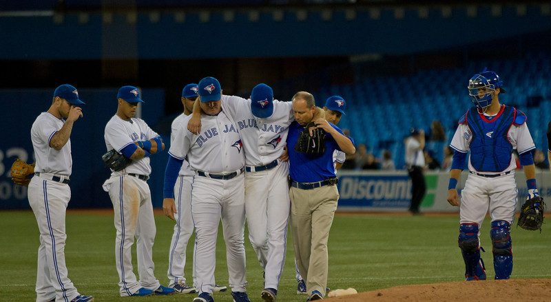 Toronto Blue Jays starting pitcher Brandon Morrow is helped off the field after taking a direct hit off a line drive in the seventh inning. The right-handed pitcher and team officials feared the worst but x-rays were negative. Toronto won 4-1 to sweep the Baltimore Orioles at Rogers Centre (JP Dhanoa)